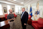 Military veterans Dave Allen, left, and Keith Harris chat in the First Data Student Veterans Lounge at the Tate Student Center. (Dorothy Kozlowski/UGA)