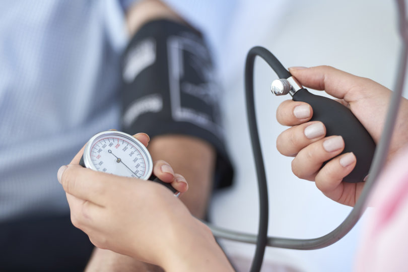 Nurse measuring blood pressure.