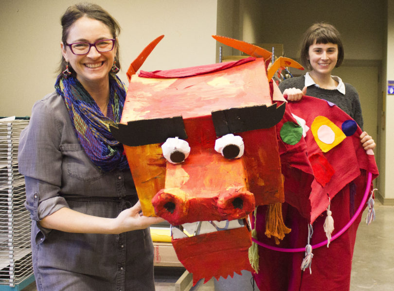 Melisa Cahnmann-Taylor (left), a professor in the UGA College of Education, and Athens artist Rae Kretzer hold a Chinese dragon similar to what will be made next month as part of Lunar New Year festivities celebrating the Big Read book, “To Live.” Kretzer will guide participants in building the dragons as part of a workshop Feb. 10-11 at the State Botanical Garden of Georgia. (Photo by Kristen Morales)