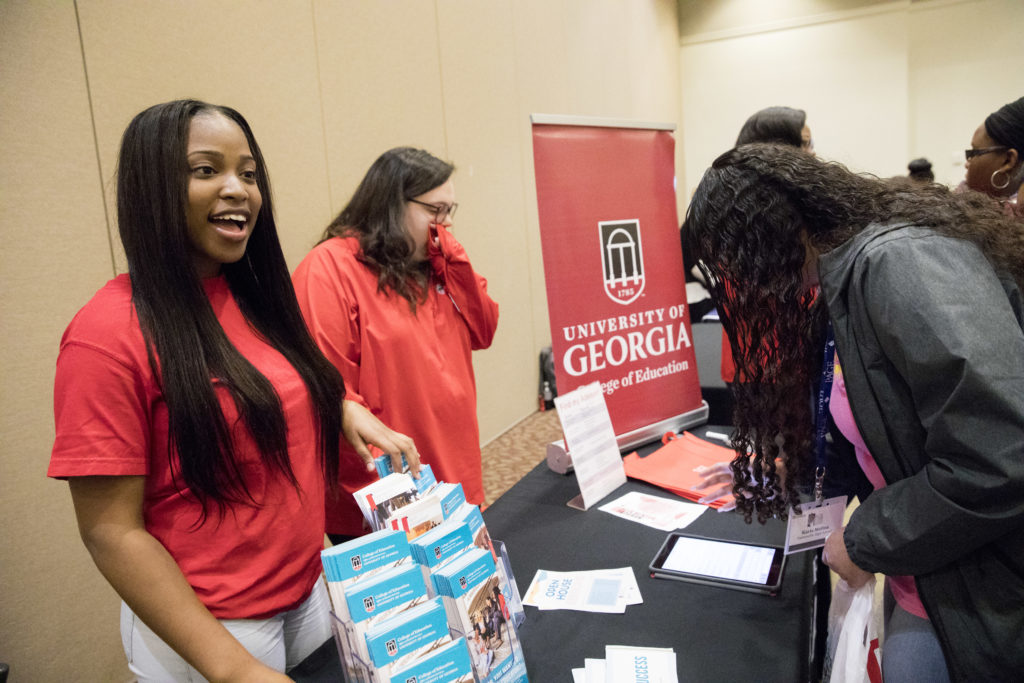 Kiara Plummer staffs the College of Education table at the recent Professional Association of Georgia Educators Student Day in the Tate Center. (Photo by Dorothy Kozlowski/UGA)
