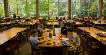 Graduate school students studying in the law library. The U.S. News Graduate School Rankings are out today.