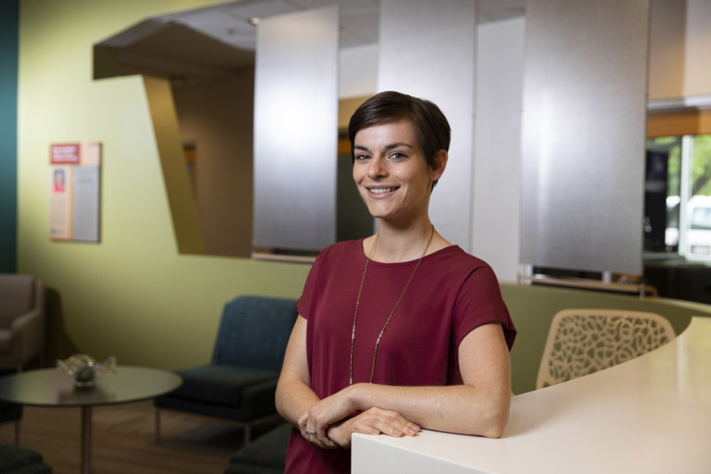 Jessica Shotwell, a Ph.D. candidate in health promotion and behavior, sits in the lobby of the Institute of Gerontology in Hudson Hall.