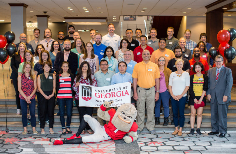 UGA President Jere W. Morehead poses with participants of this year's New Faculty Tour prior to their departure Aug. 5.