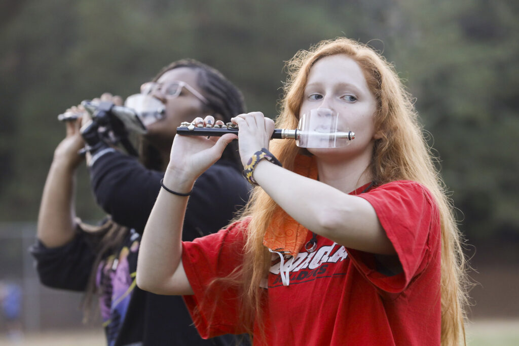 Piccolo players practicing with special mouth guards
