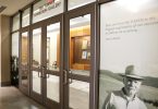 Doors and a photo of Ted Turner wearing a cowboy hat.