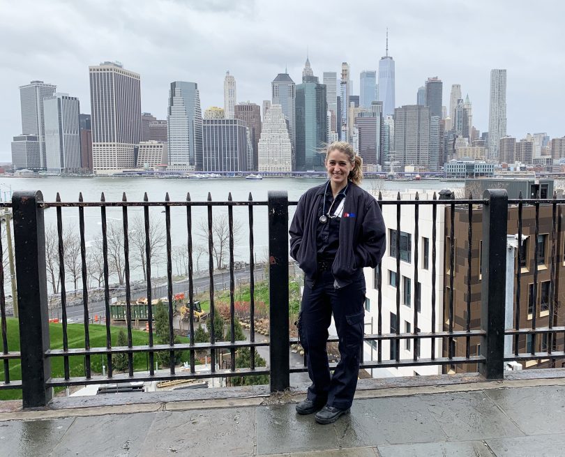 Maddy Wetterhall posing in front of New York City skyline.