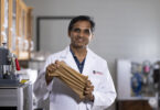 Gajanan Bhat holds an elastic nonwoven material.