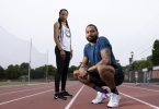 endell and Devon Williams pose on an outdoor track.