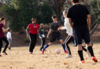 Students play a game of soccer