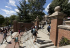 Students walking up steps on campus.