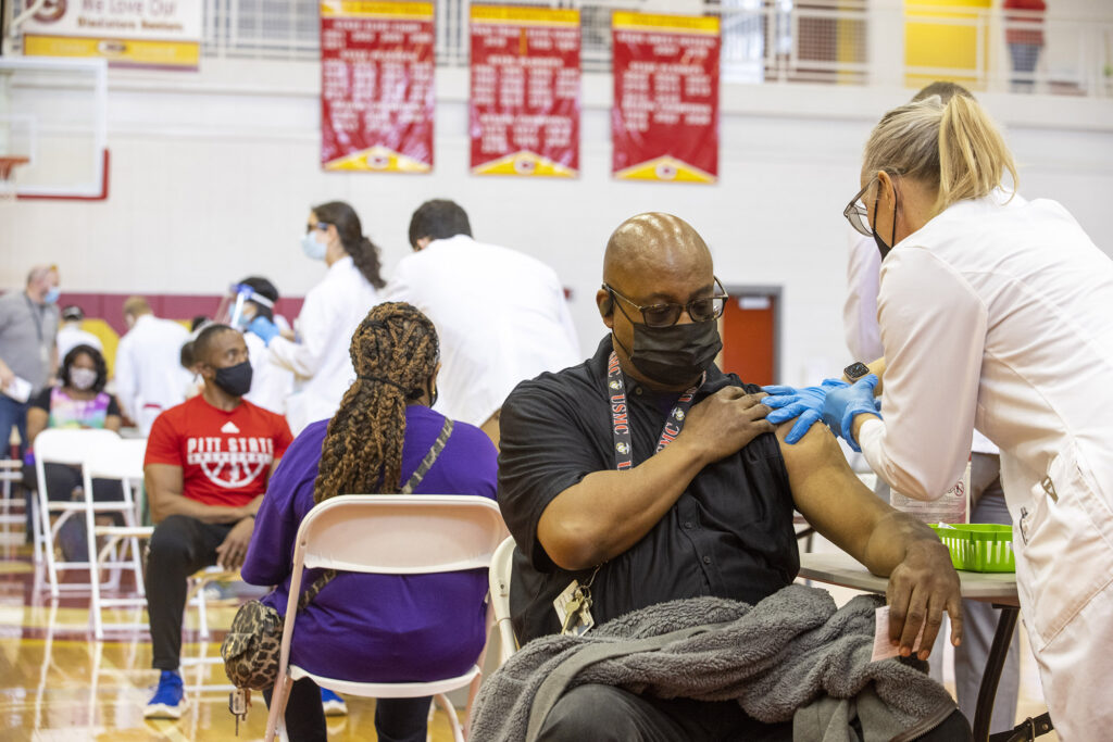 man receiving COVID-19 vaccine