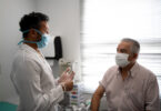 Patient in a medical consult wearing face mask