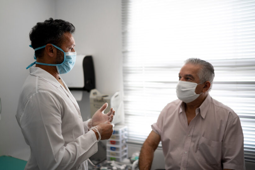 Patient in a medical consult wearing face mask