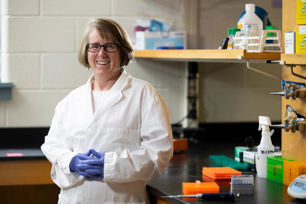 Robin Buell stand in her lab at the University of Georgia