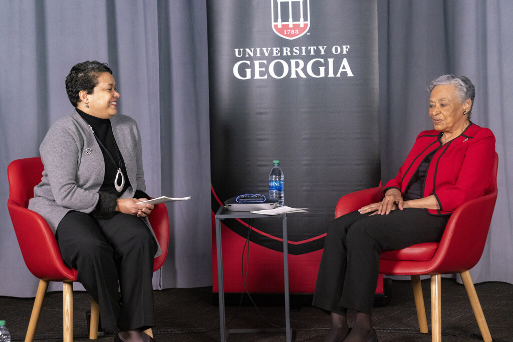 Alison Holmes speaking with Marilyn Holmes at UGA