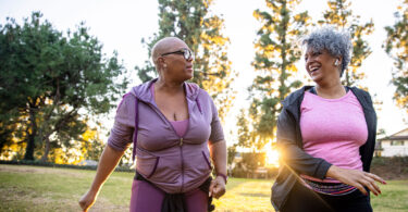 Two Black women walk together
