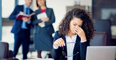 Burnout businesswoman under pressure in the office