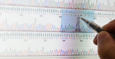 A pen is shown tracking a genetic sequence.