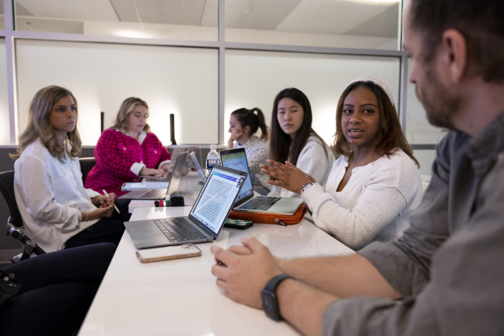 Computer science major Aniyah Norman, second from right, talks with Professor Chris Gerlach during a discussion with her team in their New Media Capstone Class.
