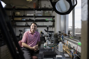 Environmental portrait of researcher Andy Davis in his laboratory.
