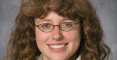 Portrait of UGA Rhodes scholar Katherine HA Vyborny, facing the camera and smiling