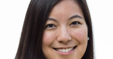 Portrait of UGA Rhodes scholar Tracy Yang, smiling and facing the camera