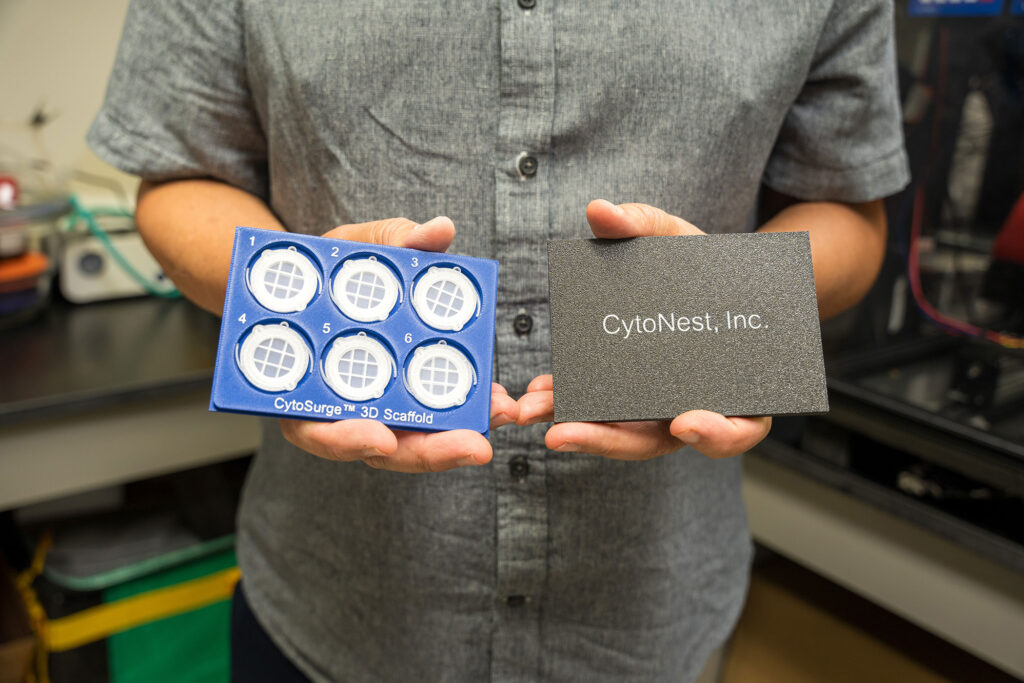 A man holds new technology from CytoNest Inc. that optimizes cell manufacturing and tissue engineering.