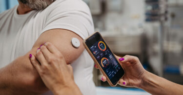 A man has his glucose levels checked.