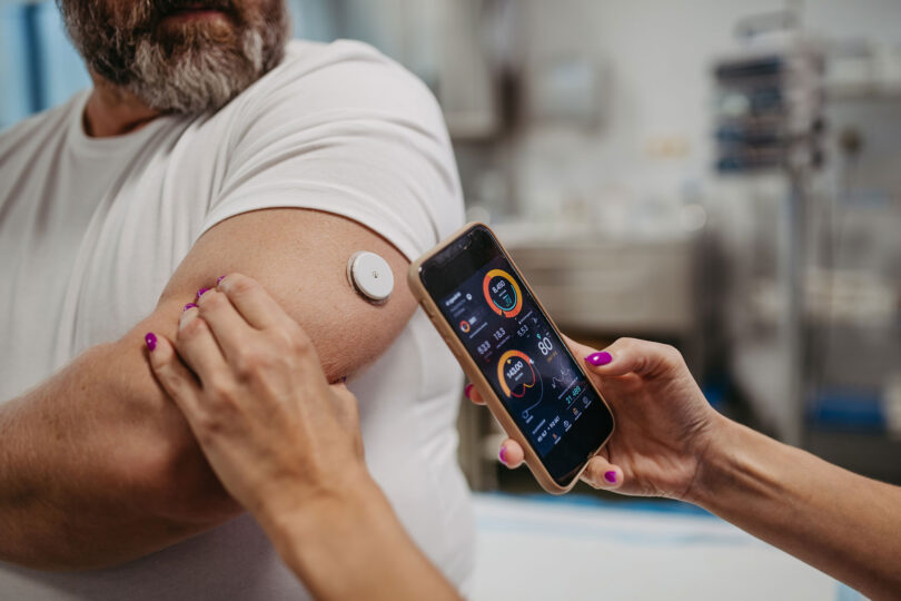 A man has his glucose levels checked.