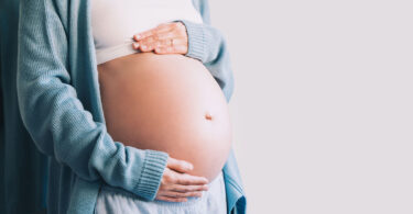 A pregnant woman is shown holding her belly. A new study suggests almost 6% of pregnant women use marijuana.