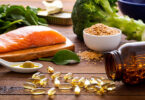 Salmon, nuts and fish oil supplements are ready to be consumed for a healthy diet.