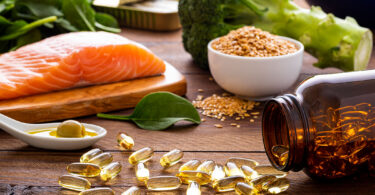 Salmon, nuts and fish oil supplements are ready to be consumed for a healthy diet.