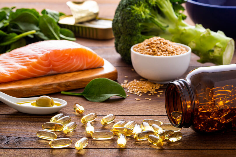 Salmon, nuts and fish oil supplements are ready to be consumed for a healthy diet.