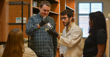 Fungus researcher Blake Billmyre works with members of his lab at the University of Georgia.