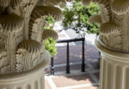 Detail of Holmes-Hunter Academic Building column capitals with the Arch in the background