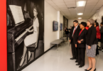 UGA President Jere W. Morehead, Mary Frances Early and Dean Denise A. Spangler view artwork of Ms. Early displayed in Aderhold Hall to celebrate the naming of the college on Feb. 25, 2020.