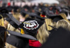 Graduate bulldog cap detail during Undergraduate Commencement.