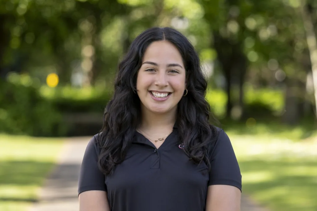Portrait of undergraduate student Val Suarez in Albert College Park at Dublin City University during a study away Maymester in Ireland.