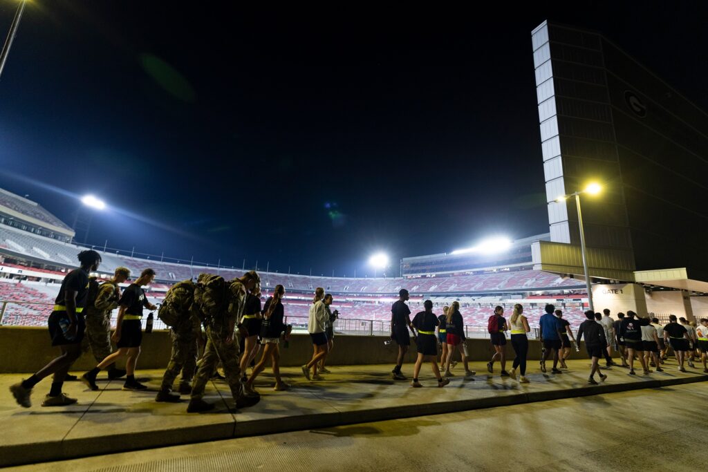 Army and Air Force ROTC cadets walk towards the stadium.