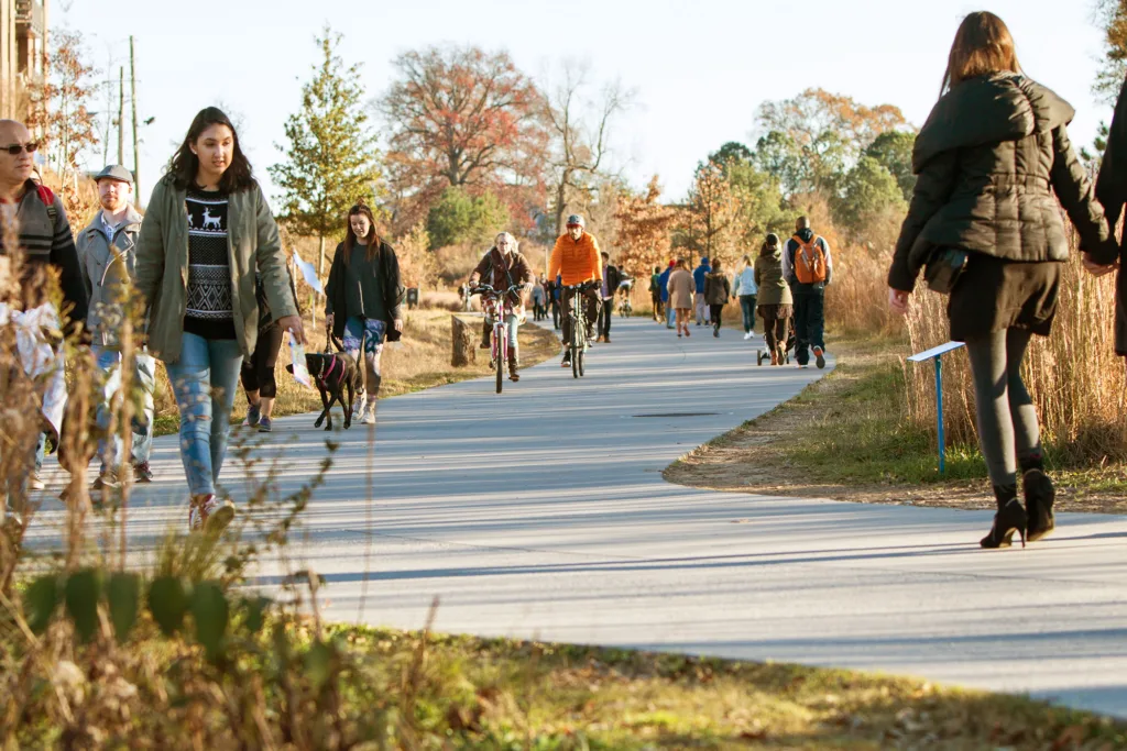 People walk, run and bike along the Atlanta Beltline recreational area in the Old Fourth Ward in Atlanta, Georgia.