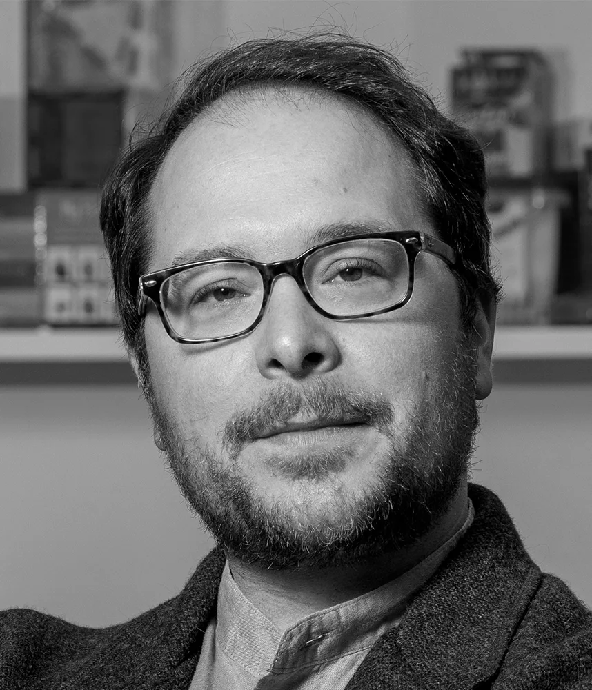 Black-and-white headshot of Drew Abney