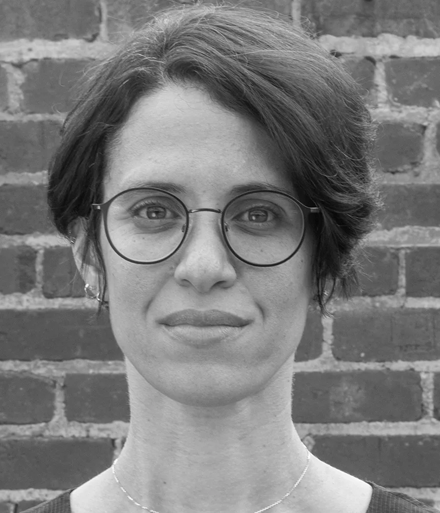 Black-and-white headshot of Sharina Maíllo-Pozo