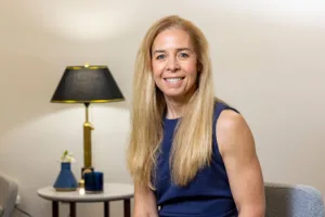 Environmental portrait of female researcher Paula Lemons in an office setting.
