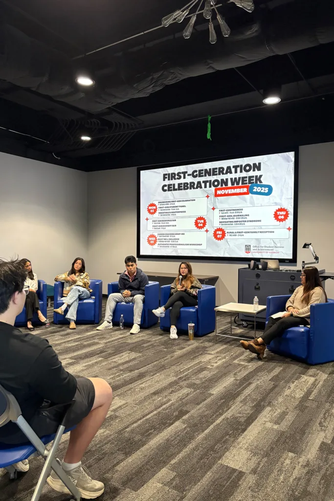 Students sit in blue chairs leading a First-Generation Celebration Week panel discussion.