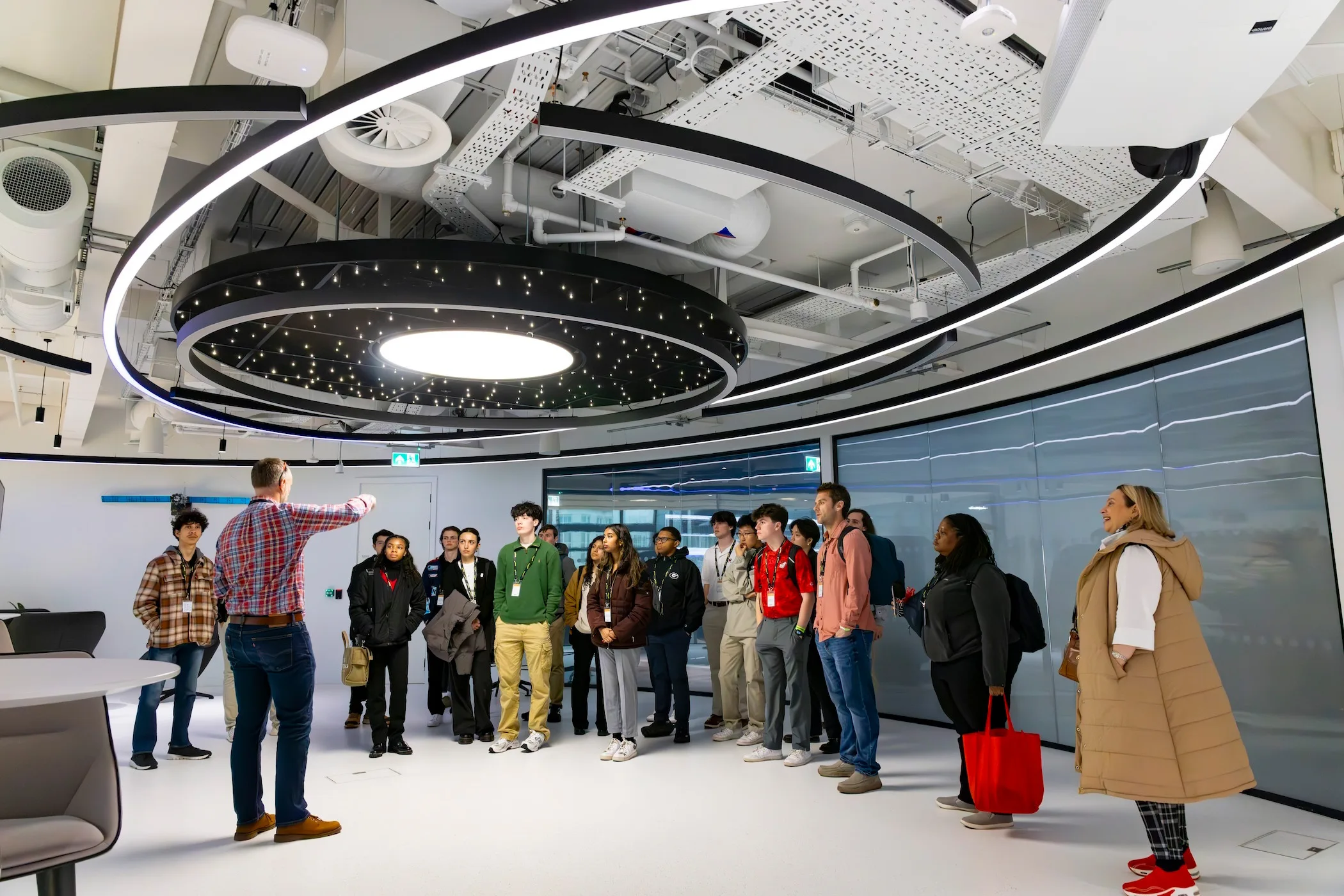 Viasat systems engineer John O’Connor speaks to UGA undergraduate students about the satellite communications business at the company headquarters during a Connect Abroad spring break trip to London, England.