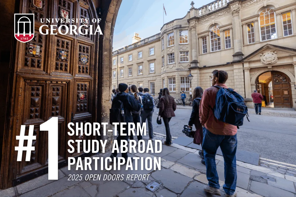 Graphic with UGA logo and “#1 short-term study abroad participation, 2025 Open Doors Report” text on a photo of students in a courtyard during a study abroad program.