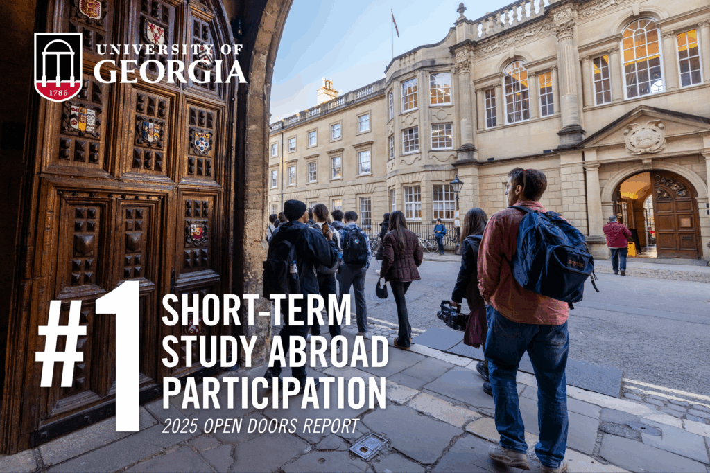 Graphic with UGA logo and “#1 short-term study abroad participation, 2025 Open Doors Report” text on a photo of students in a courtyard during a study abroad program.
