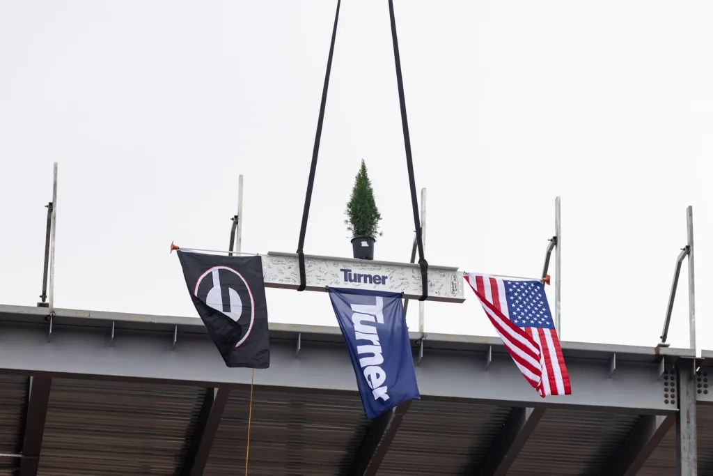 A beam is raised into the medical education and research building during the UGA School of Medicine topping-out ceremony on Nov. 25. 