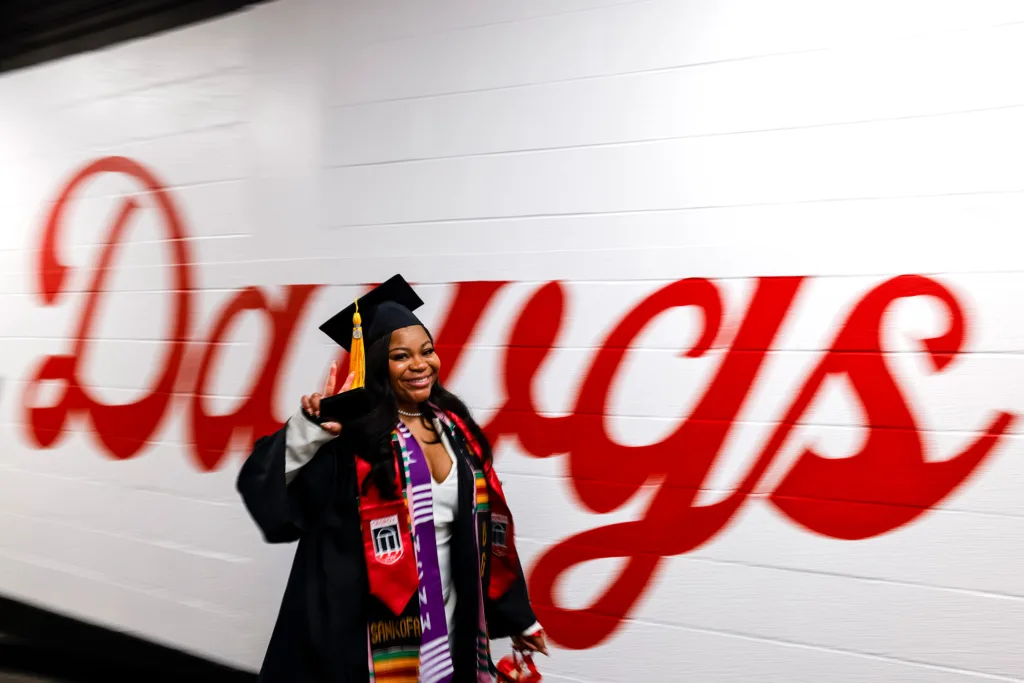 Graduate enters the building during fall undergraduate Commencement.