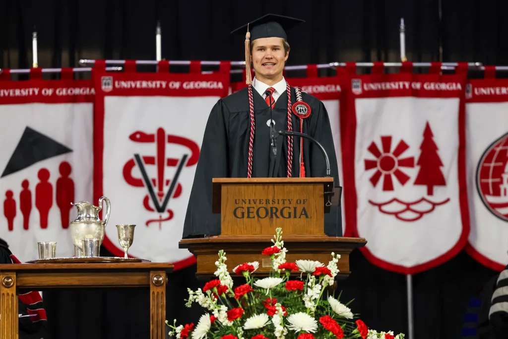 Graduate Reid Matthew McAdams gives remarks during fall undergraduate Commencement.